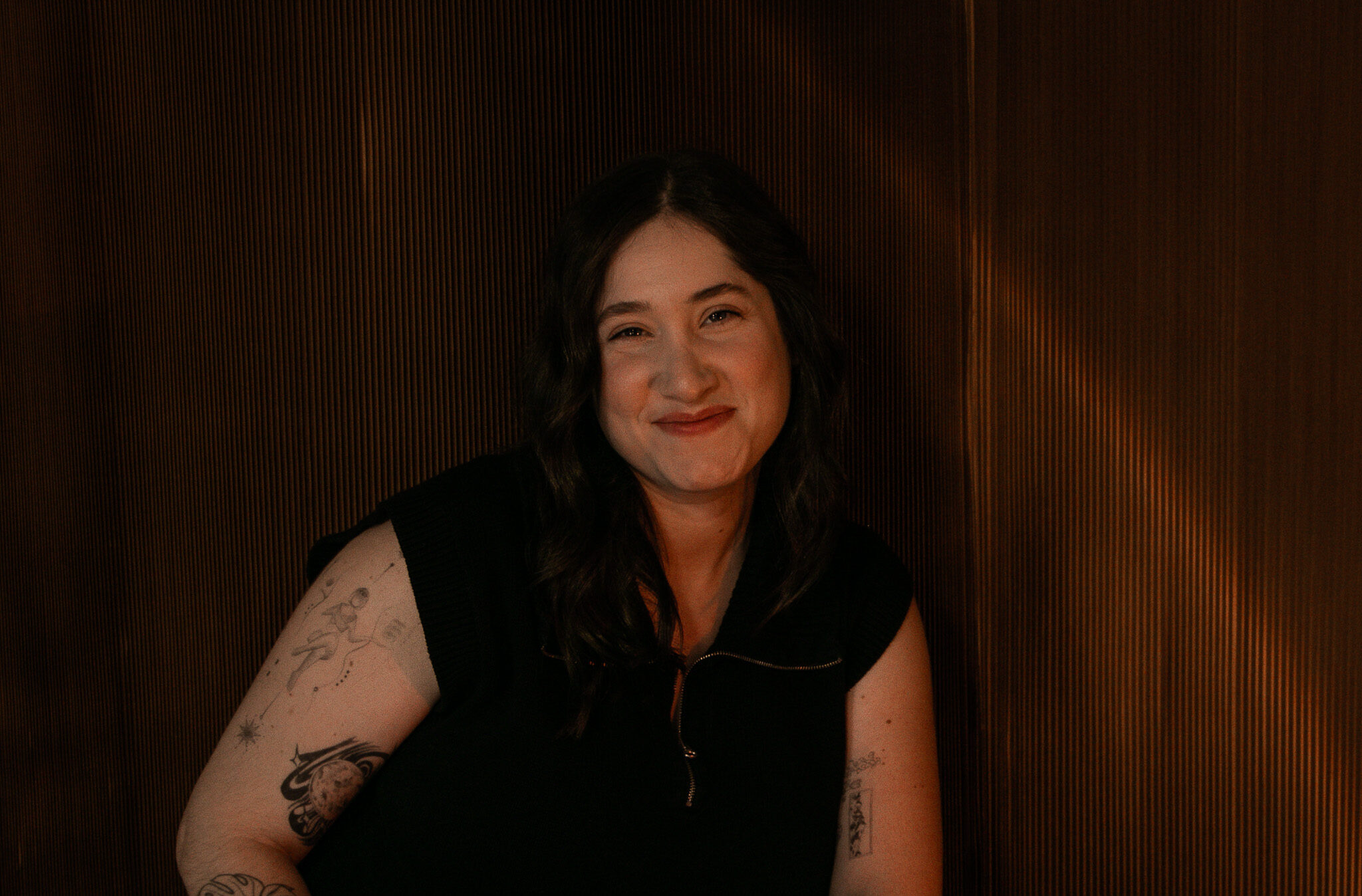 Woman smiling in black top talks about intentional life and business