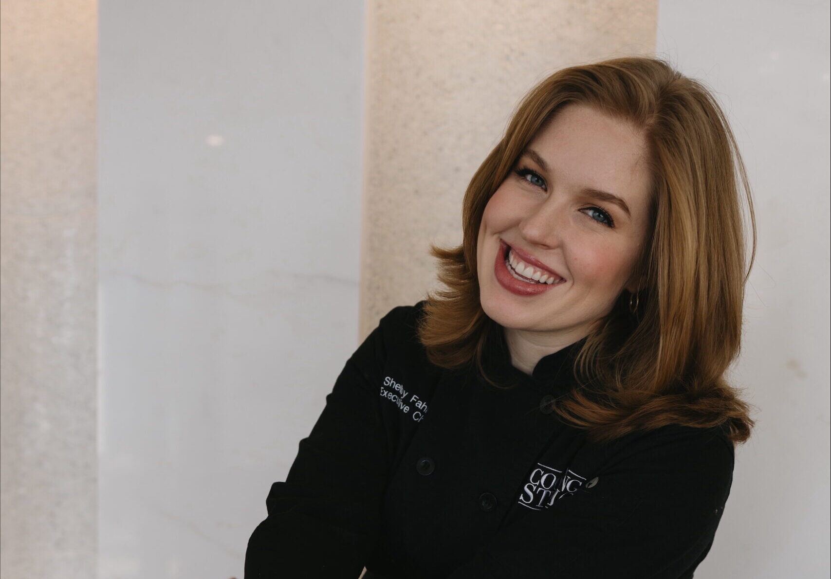 Woman wearing black, smiling, talks about building a life you love